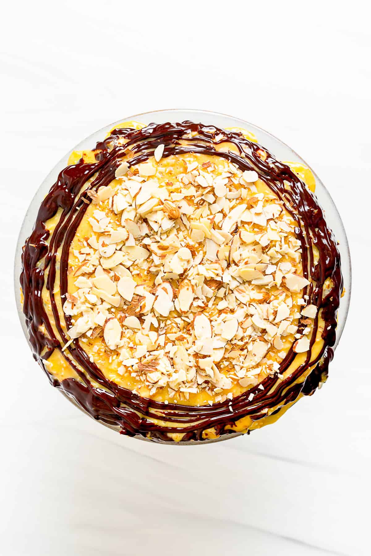 German Chocolate Cheesecake on a cake plate.