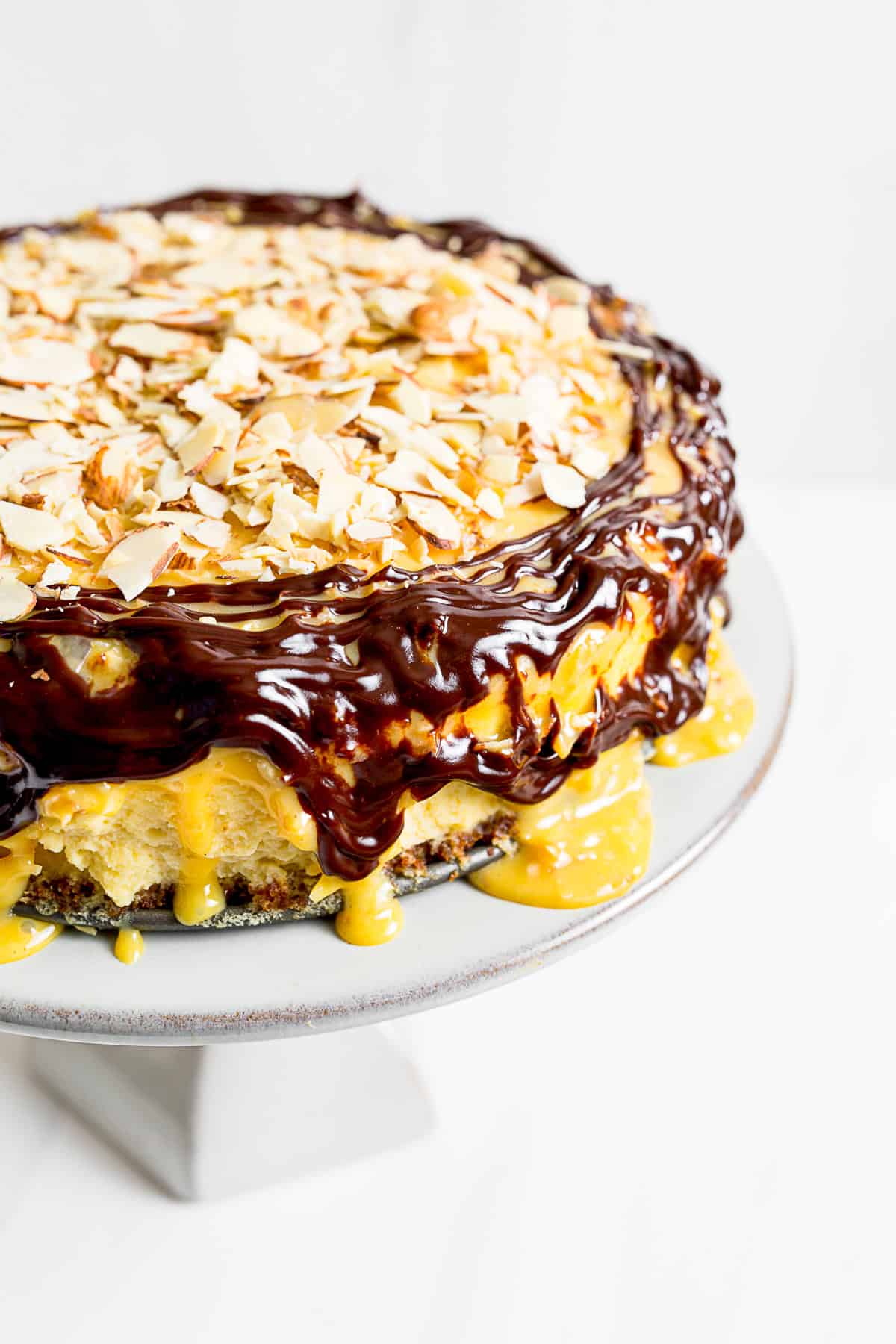German Chocolate Cheesecake topped with chocolate ganache.