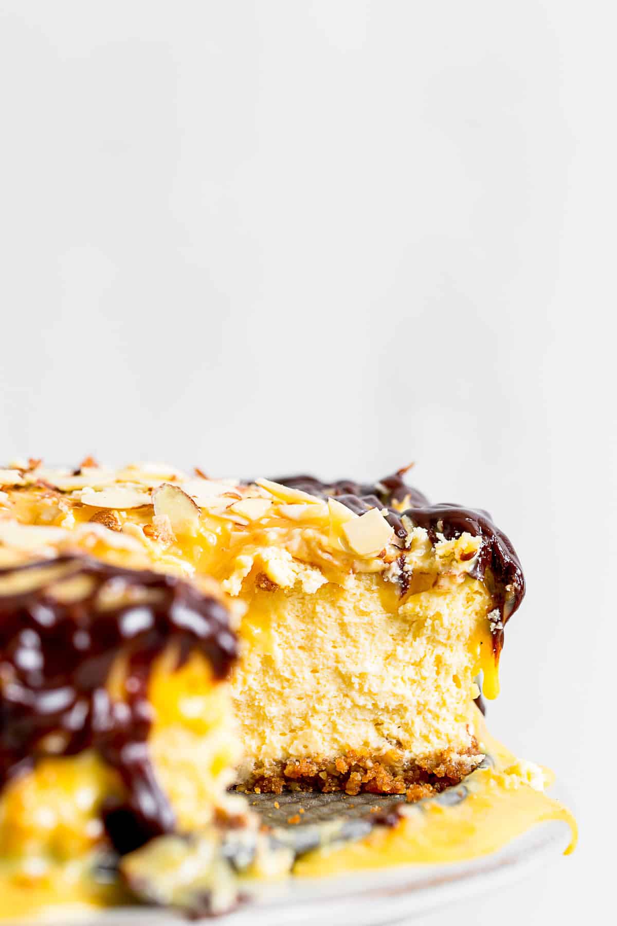 German Chocolate Cheesecake sliced to show cheesecake center.