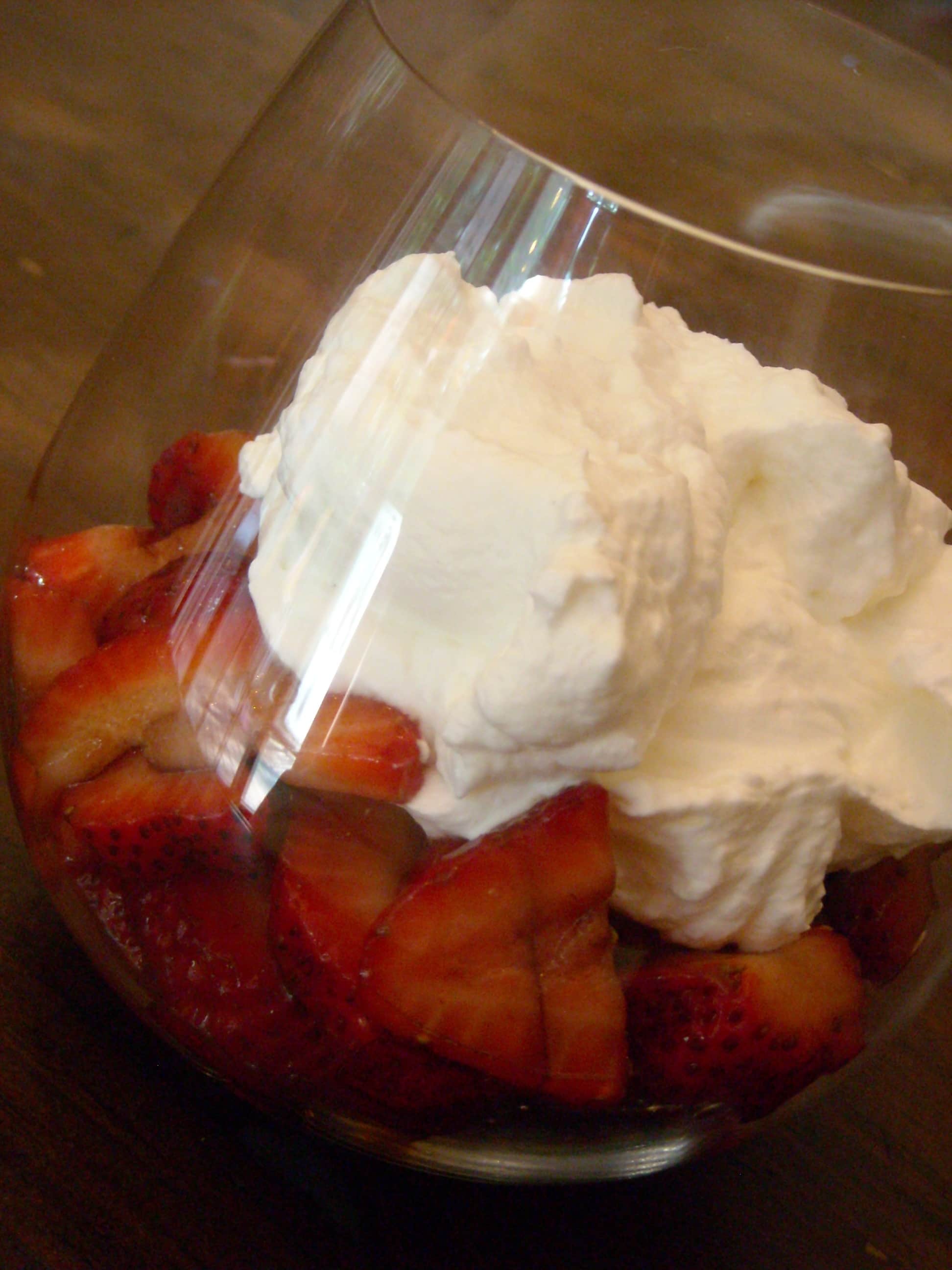DSCN2299 Balsamic Strawberries in a glass topped with fresh whipped cream.