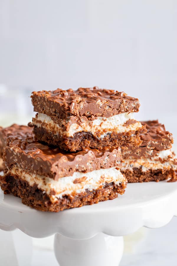 Peanut Butter Marshmallow Krispie Topped Brownies cut on a plate.
