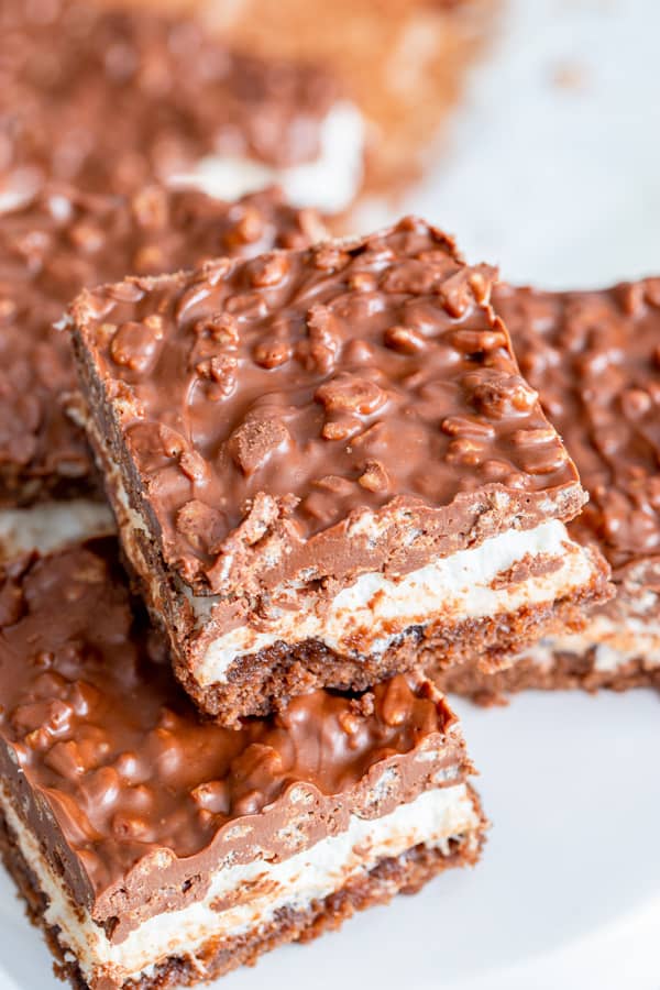 Peanut Butter Marshmallow Krispie Topped Brownies sliced to show the layers.