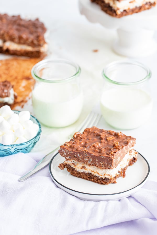 Peanut Butter Marshmallow Krispie Topped Brownies served on a plate.