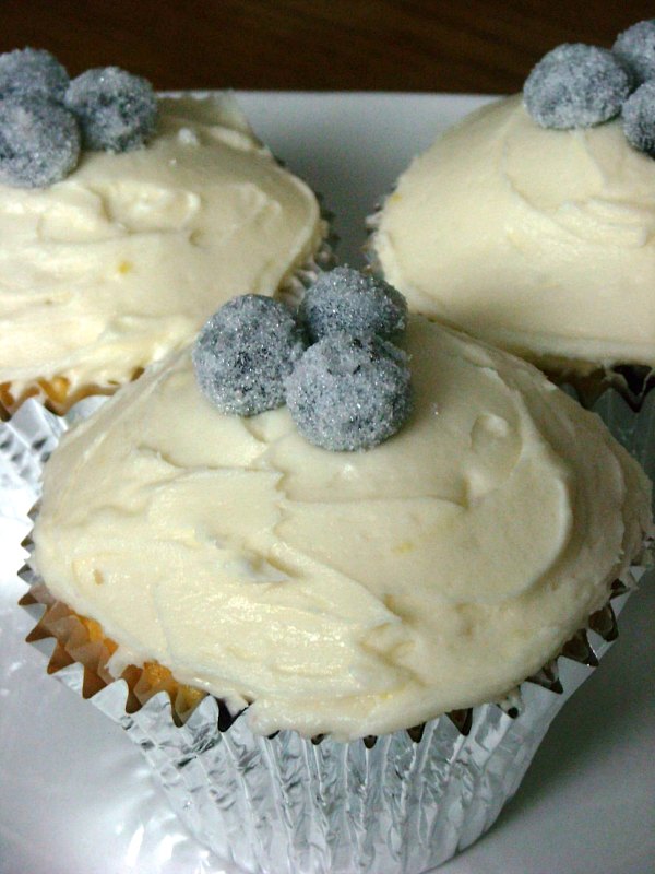 These lemon blueberry cupcakes are perfect balance of sweet and tart. Topped with lemon buttercream and homemade sparkly sugared blueberries.  