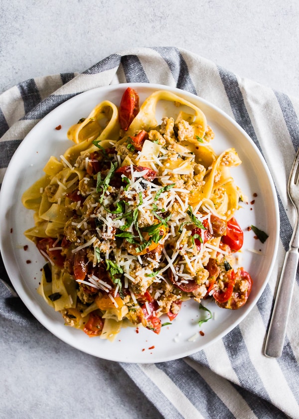 Summer Bolognese on a plate with a fork. 