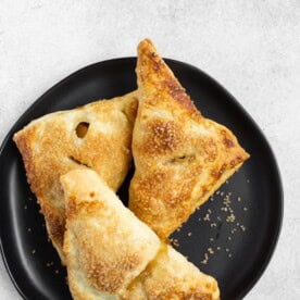 easy apple turnovers on a black plate