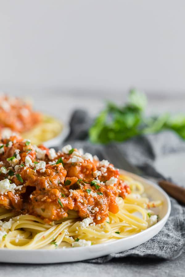 Shrimp Feta Pasta on a plate with feta cheese. 