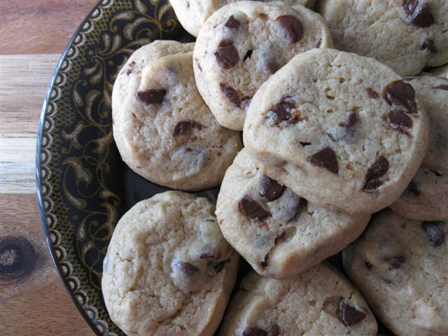 Chewy Chocolate Chip Cookies via Nutmeg Nanny Chewy Chocolate Chip Cookies on a small plate.