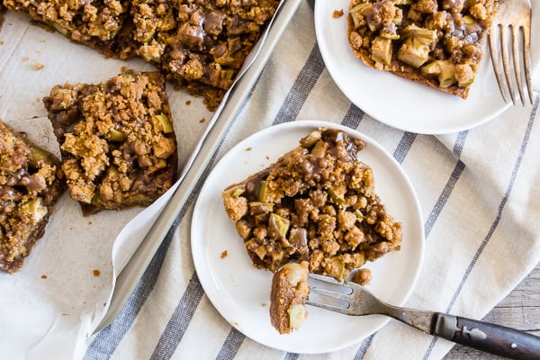 Cinnamon Apple Streusel Bars ready to serve on a plate.
