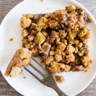 These cinnamon apple streusel bars are the perfect mashup of Dutch apple pie and a crunchy apple bar dessert. Super simple to make and sure to be the hit of any party or family gathering. Plus you're going to love the drizzle of vanilla bean maple glaze. 