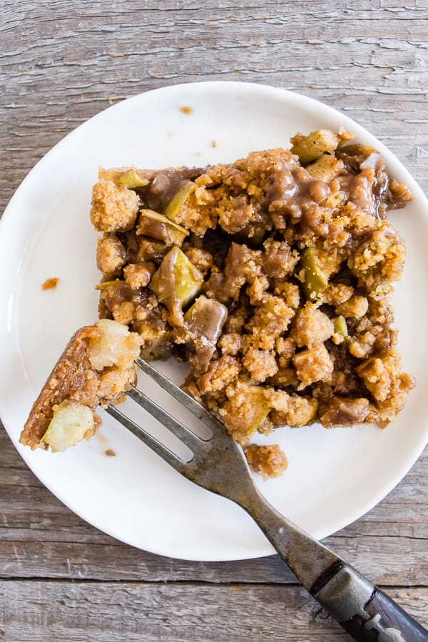 Cinnamon Apple Streusel Bars on a plate with a fork.