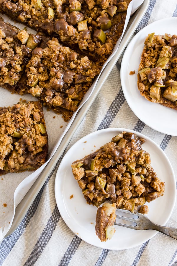 Cinnamon Apple Streusel Bars sliced on a plate.