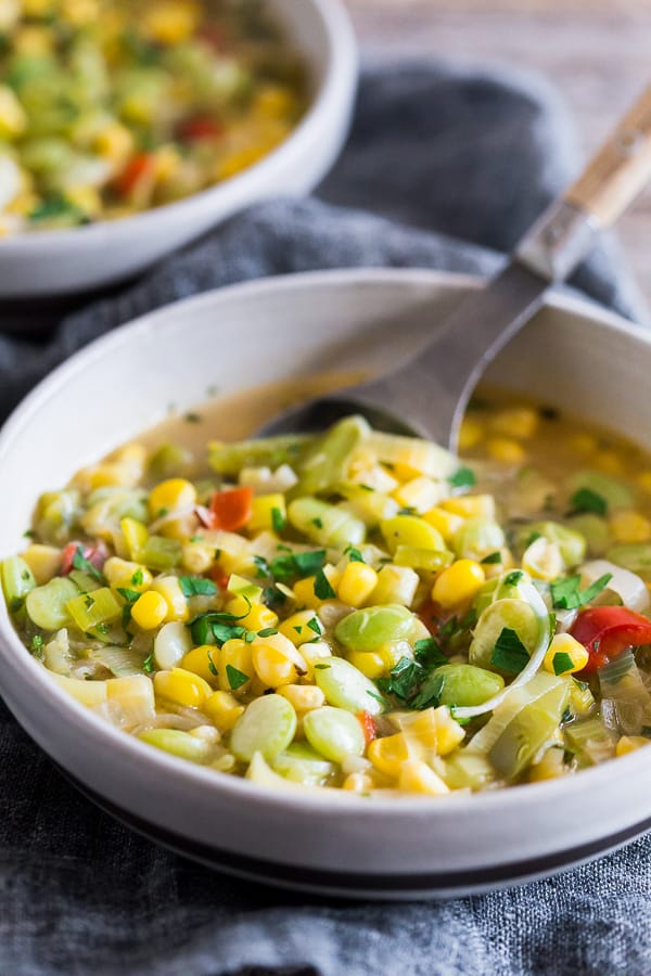 This super easy vegan and vegetarian succotash soup is packed full of lima beans, corn and fresh herbs. Ready in just 30 minutes and perfect for dinner or a light summer lunch. Trust me, you'll love this soup!