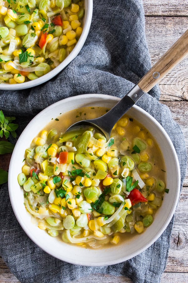 This super easy vegan and vegetarian succotash soup is packed full of lima beans, corn and fresh herbs. Ready in just 30 minutes and perfect for dinner or a light summer lunch. Trust me, you'll love this soup!