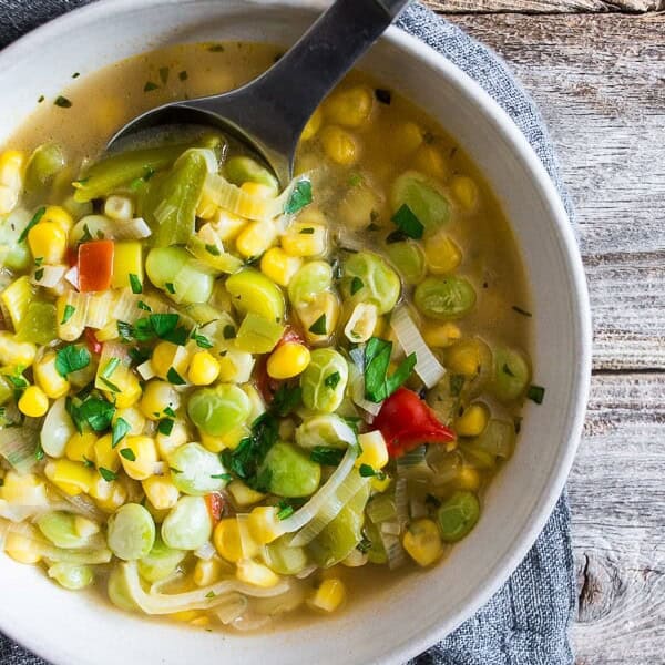 This super easy vegan and vegetarian succotash soup is packed full of lima beans, corn and fresh herbs. Ready in just 30 minutes and perfect for dinner or a light summer lunch. Trust me, you'll love this soup!