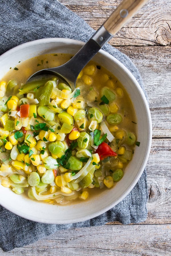 This super easy vegan and vegetarian succotash soup is packed full of lima beans, corn and fresh herbs. Ready in just 30 minutes and perfect for dinner or a light summer lunch. Trust me, you'll love this soup!