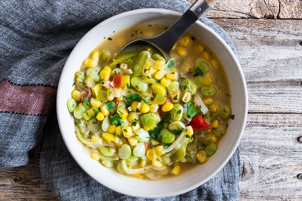 This super easy vegan and vegetarian succotash soup is packed full of lima beans, corn and fresh herbs. Ready in just 30 minutes and perfect for dinner or a light summer lunch. Trust me, you'll love this soup!