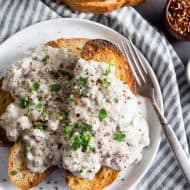sos creamed beef recipe on a white plate with a fork