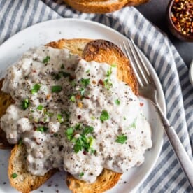 sos creamed beef recipe on a white plate with a fork