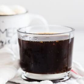 This homemade gingerbread syrup is made with dark brown sugar, molasses, lots of freshly grated ginger and a touch of winter spices. You'll love how easy this syrup is to make and it's perfect in hot lattes, iced coffee or even hot chocolate!
