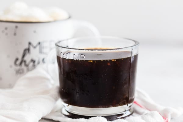This homemade gingerbread syrup is made with dark brown sugar, molasses, lots of freshly grated ginger and a touch of winter spices. You'll love how easy this syrup is to make and it's perfect in hot lattes, iced coffee or even hot chocolate! 