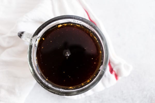 Homemade Gingerbread Syrup in a small glass jar.