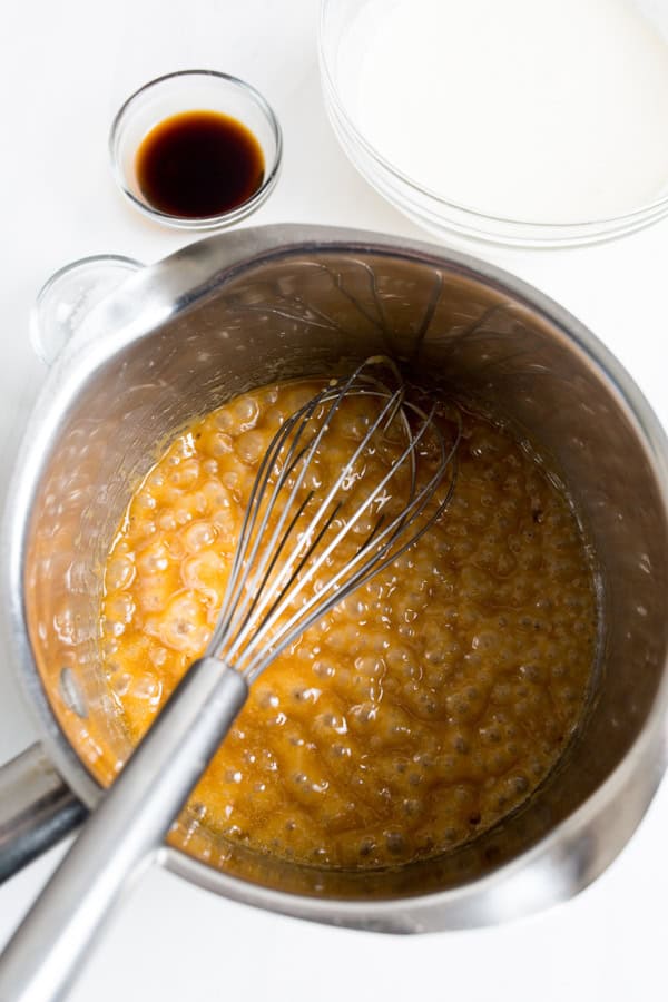 Caramel bubbling in a pot.