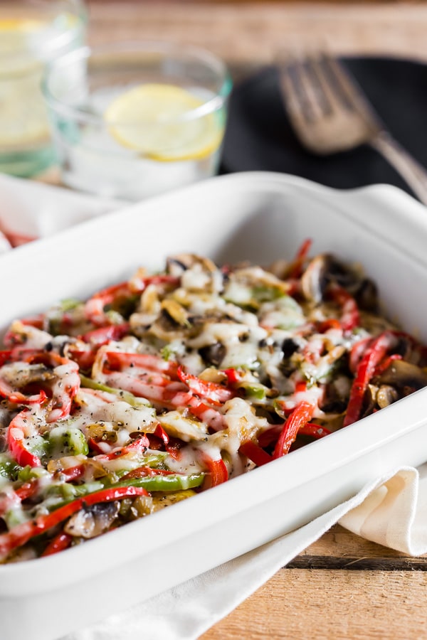 Lightly Smothered Chicken in a white casserole dish. 