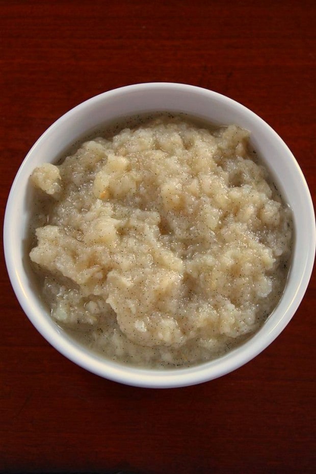 vanilla bean pear sauce sitting in a while bowl