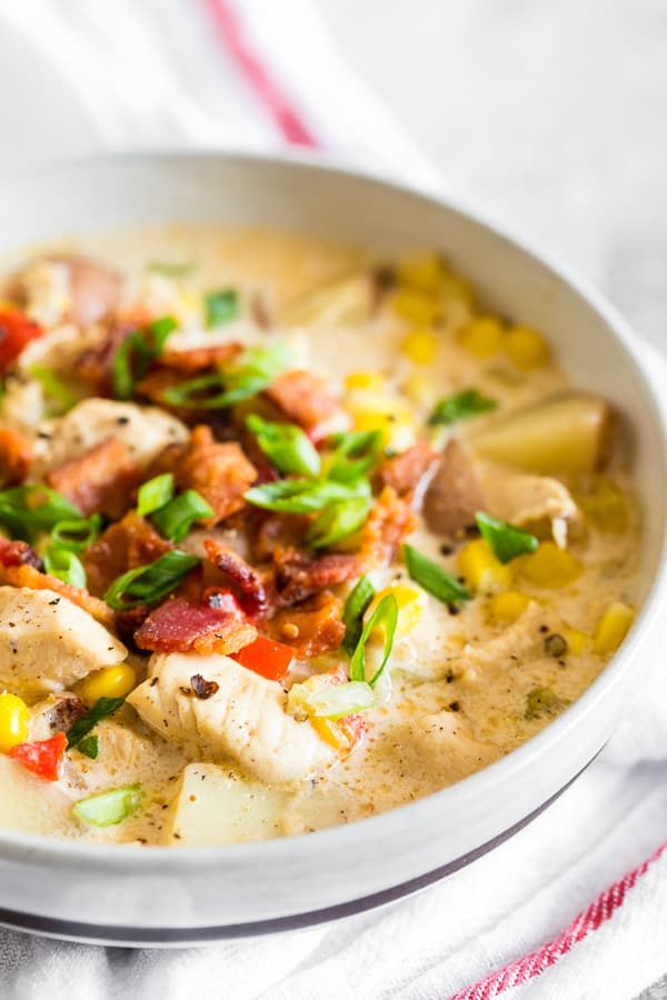 Chicken Corn Chowder served with green onions and bacon. 