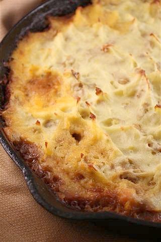 This delicious Irish stout shepherd's pie is full of ground lamb and diced vegetables. The Irish stout creates a thick gravy and is topped with potatoes.