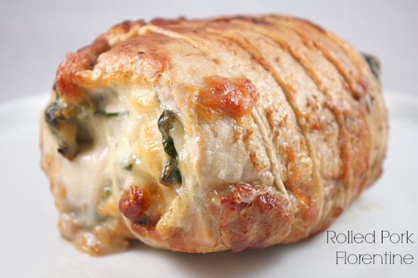Rolled Pork Florentine on a white plate. 