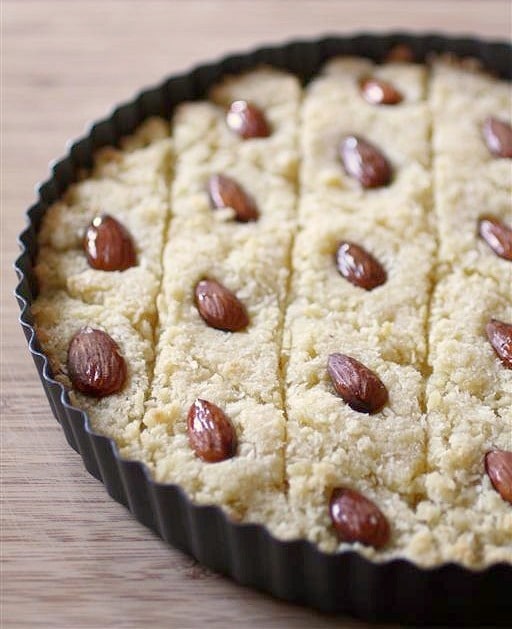 This basbousa is made with semolina flour, almonds, coconut and a delicious rose water scented sugar syrup. It's so delicious and so easy to make!