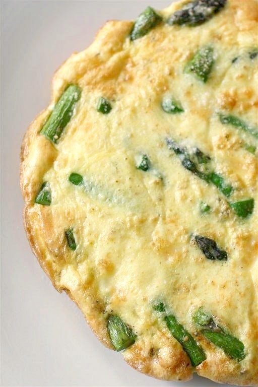 Asparagus Frittata sprinkled with Parmesan cheese.