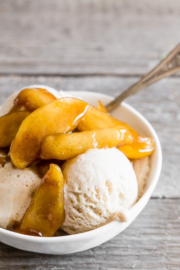 Vanilla Spiced Apples spooned over vanilla bean ice cream.