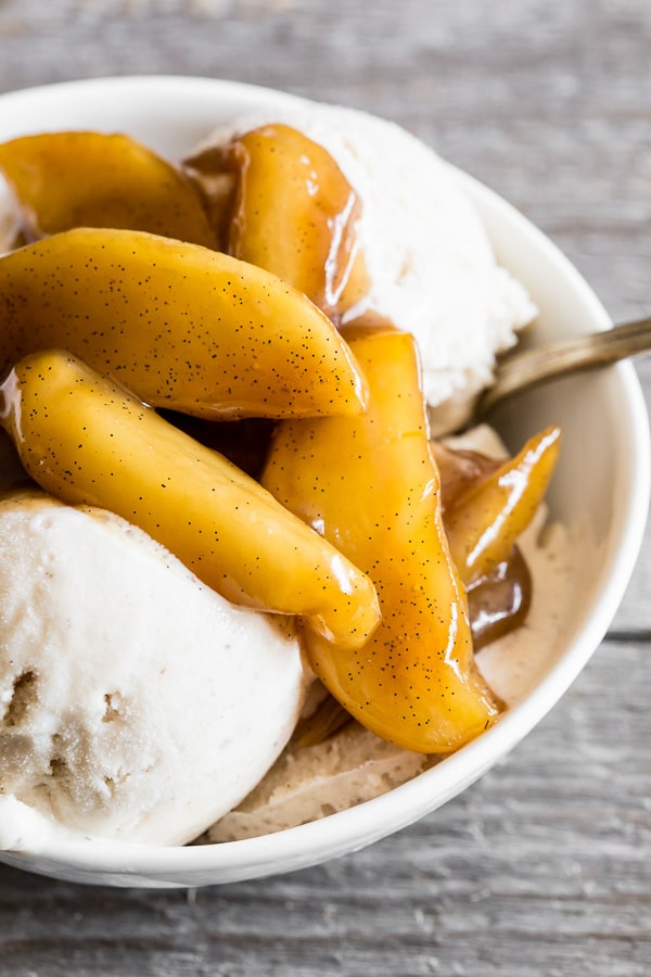 Vanilla Spiced Apples in a bowl with ice cream.