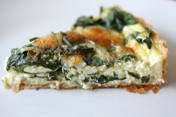 Swiss Chard, Leek and Gruyere Quiche by Nutmeg Nanny Swiss Chard Leek Quiche sliced on a plate.