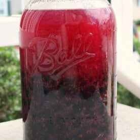 This homemade cassis recipe will teach you how to go from fresh picked black currants to deliciously sweet cassis liqueur. So easy to make and delicious!