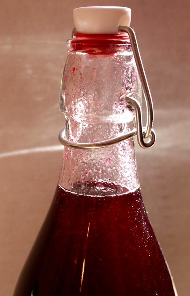 This homemade cassis recipe will teach you how to go from fresh picked black currants to deliciously sweet cassis liqueur. So easy to make and delicious!
