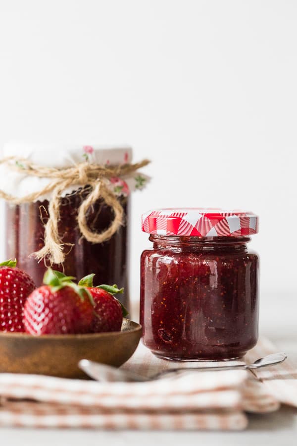 vanilla bean strawberry jam in small glass jars