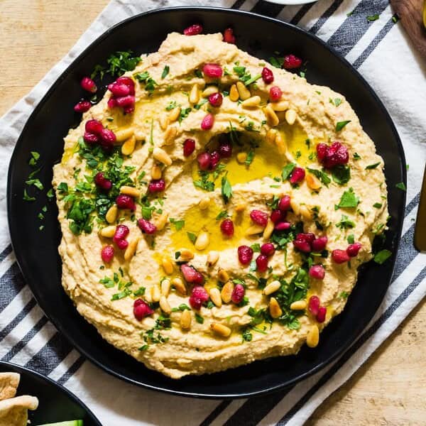 This tahini free lemon hummus is packed full of cashew butter, chickpeas and lots of lemon and garlic flavor. Perfectly smooth and perfect for dipping with toasted pita or crunchy vegetables. 