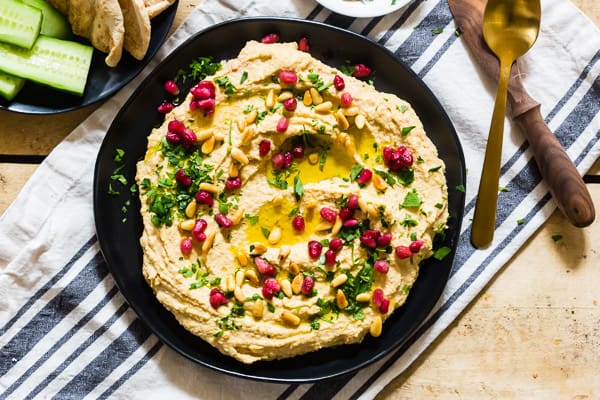 Tahini Free Hummus on a black plate.