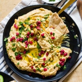 This tahini free lemon hummus is packed full of cashew butter, chickpeas and lots of lemon and garlic flavor. Perfectly smooth and perfect for dipping with toasted pita or crunchy vegetables.