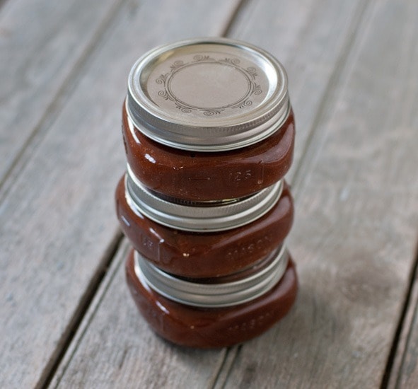 Slow Cooker Homemade Ketchup jars stacked on top of each other. 