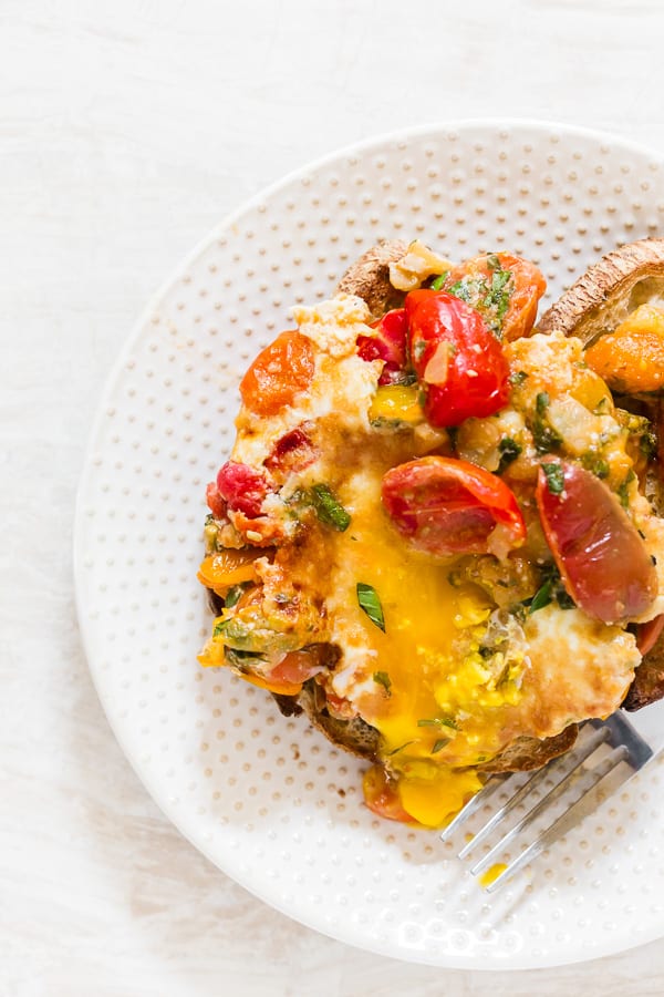 Bruschetta Baked Eggs on a plate. 