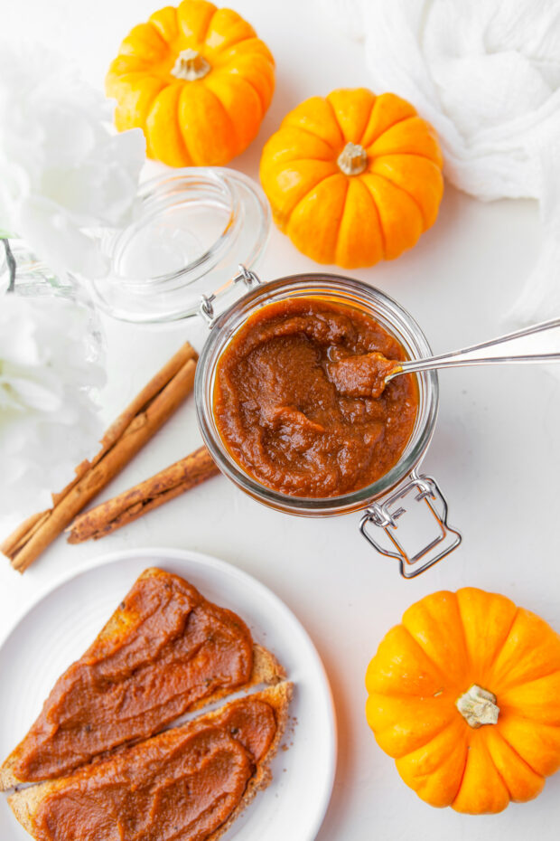 Homemade Pumpkin Butter on a table with toast. 
