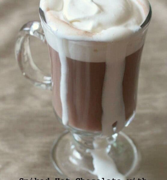This spiked hot chocolate with marshmallow vodka whipped cream is the perfect cold winter day cocktail. Comforting and delicious. You'll love this!