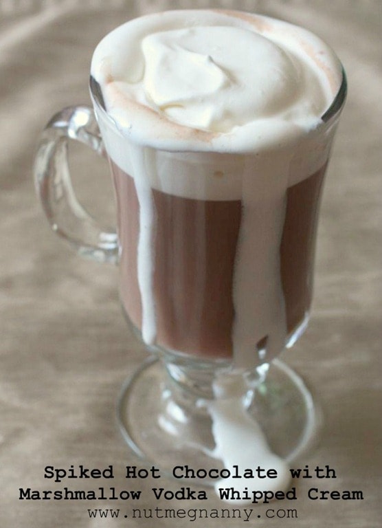 This spiked hot chocolate with marshmallow vodka whipped cream is the perfect cold winter day cocktail. Comforting and delicious. You'll love this!