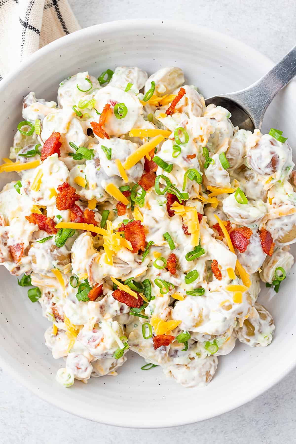 Bacon Ranch Potato Salad by Nutmeg Nanny Bacon Ranch Potato Salad in a serving dish.