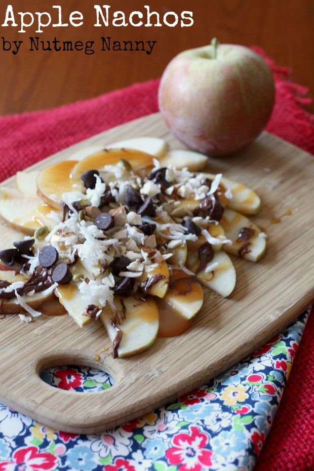 Apple Nachos by Nutmeg Nanny apple nachos on a wooden platter.